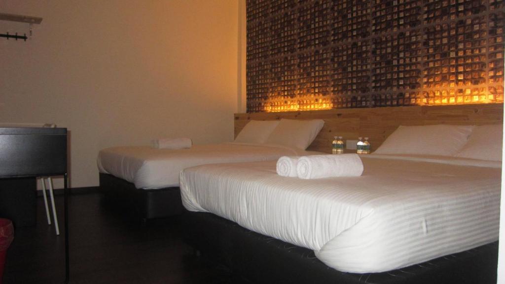 Postel nebo postele na pokoji v ubytování Dream Garden Hotel