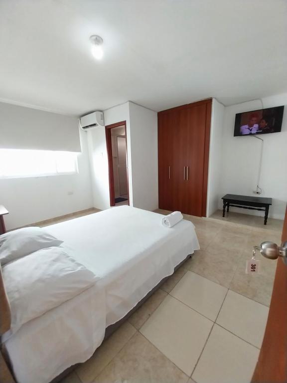 Postel nebo postele na pokoji v ubytování Hotel Sierra Nevada B&B SAS