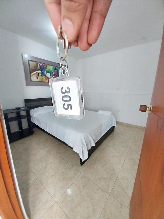 Postel nebo postele na pokoji v ubytování Hotel Sierra Nevada B&B SAS
