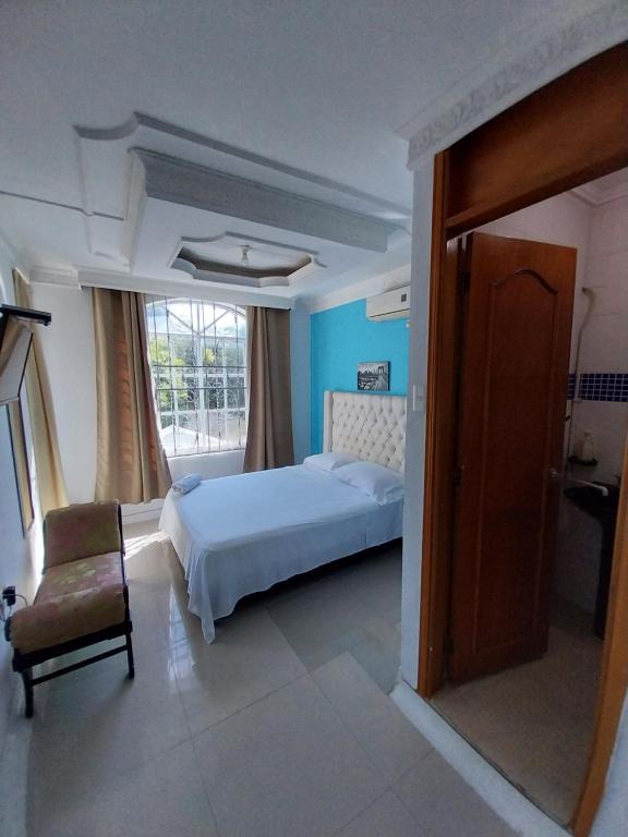 Postel nebo postele na pokoji v ubytování Hotel Sierra Nevada B&B SAS
