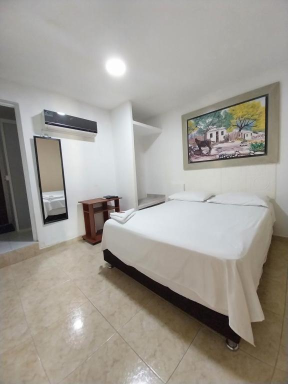 Postel nebo postele na pokoji v ubytování Hotel Sierra Nevada B&B SAS