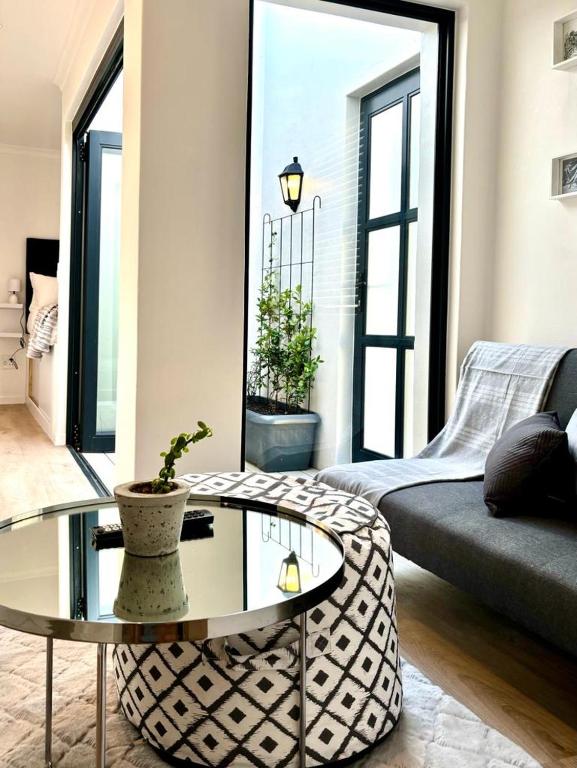 a living room with a coffee table and a couch at The Saasveld in Cape Town