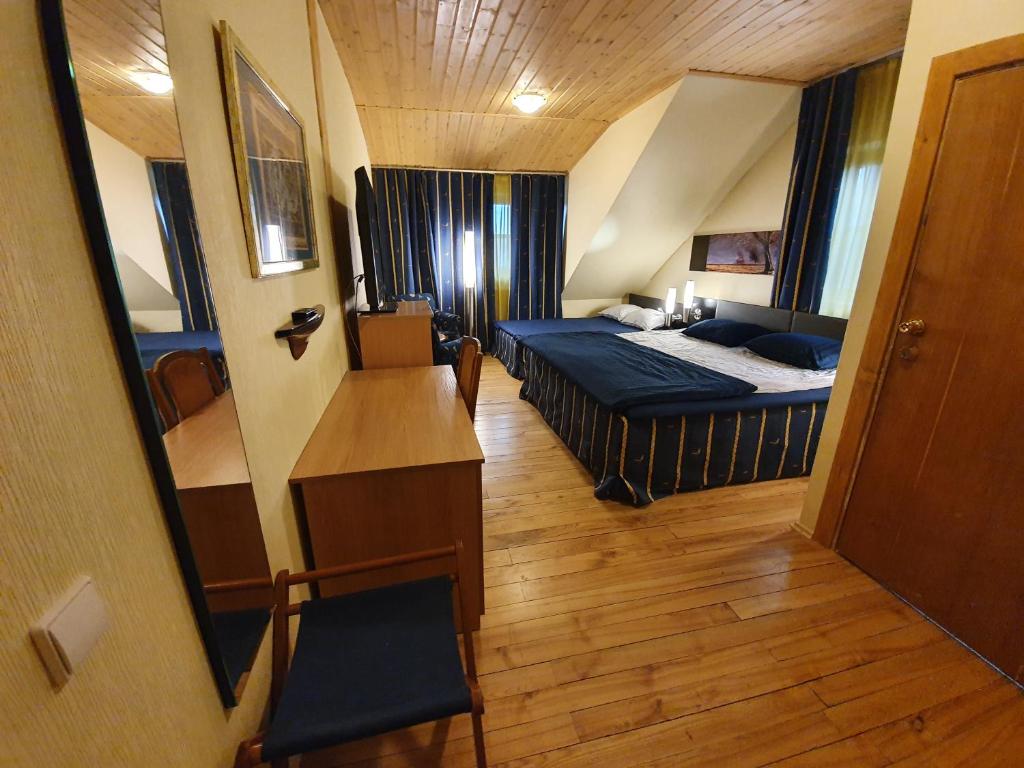 Ένα ή περισσότερα κρεβάτια σε δωμάτιο στο Vila Dubysa