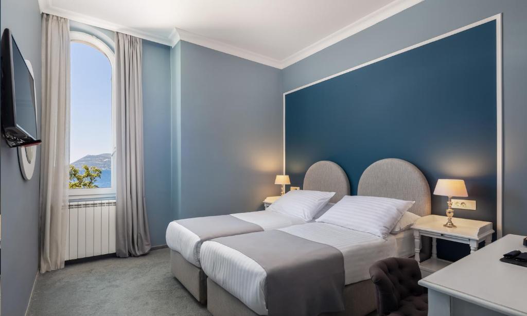 Кровать или кровати в номере Aminess Younique Korcula Heritage Hotel