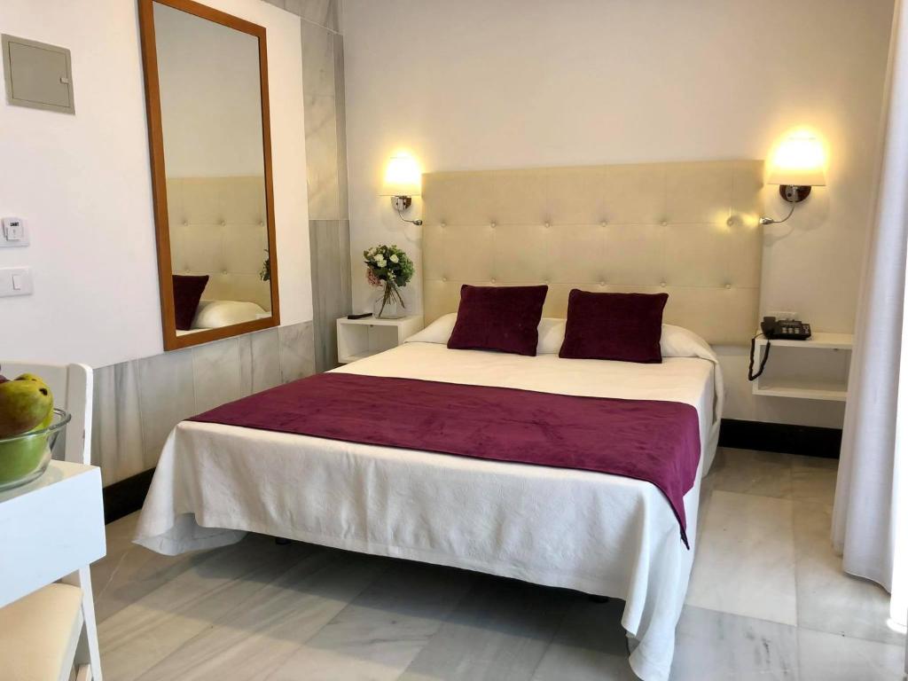 Postel nebo postele na pokoji v ubytování Hotel Océano Centro