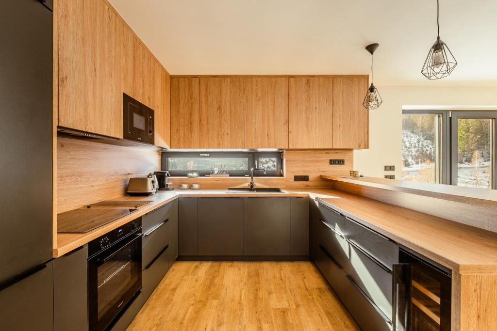 Kuchyň nebo kuchyňský kout v ubytování Chalet na Fialce