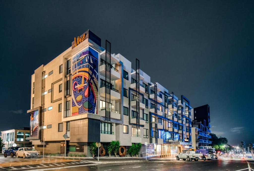 a building with a mural on the side of it at Vue Apartments Geelong in Geelong