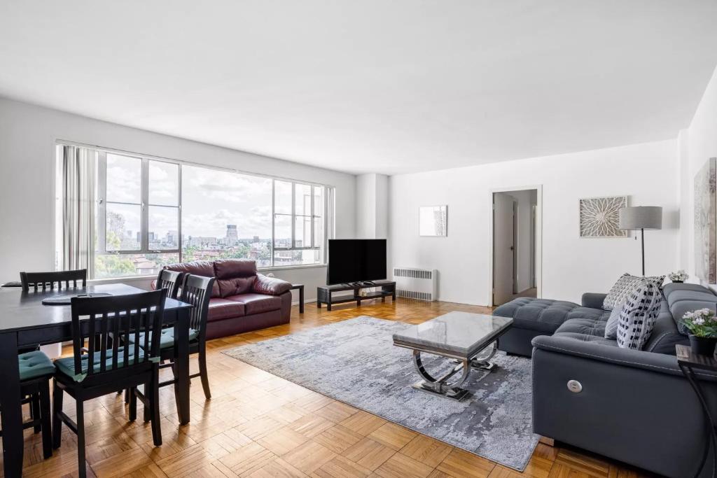 a living room with a couch and a table at Spacious 2 Bedroom 2 Bathroom Unit Great Location in Los Angeles