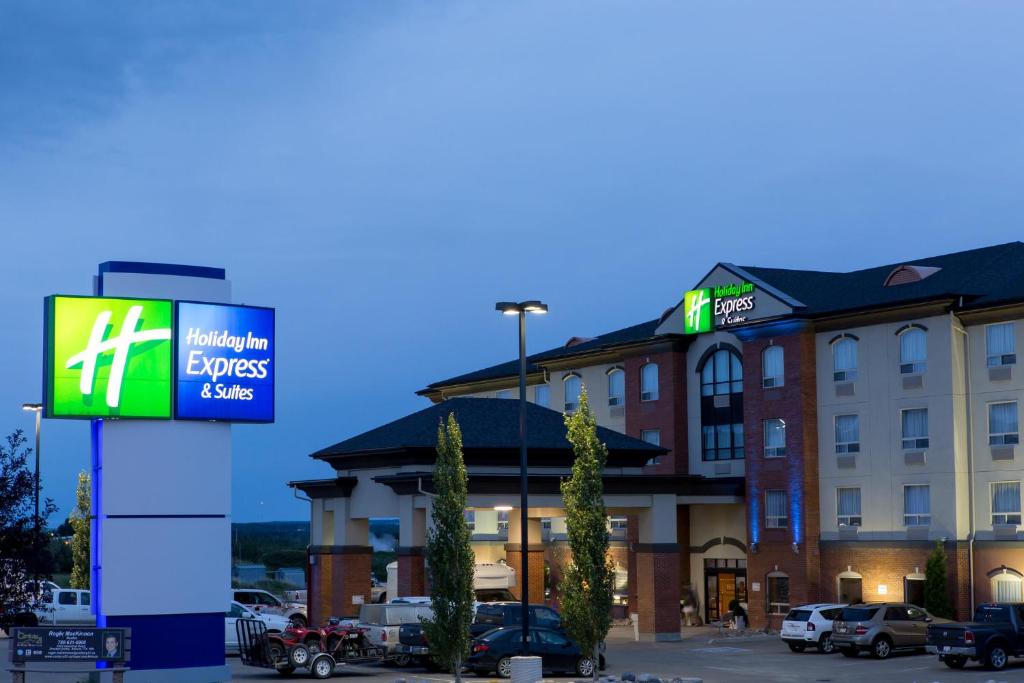 a hotel with a sign in front of a building at Holiday Inn Express & Suites Drayton Valley, an IHG Hotel in Drayton Valley