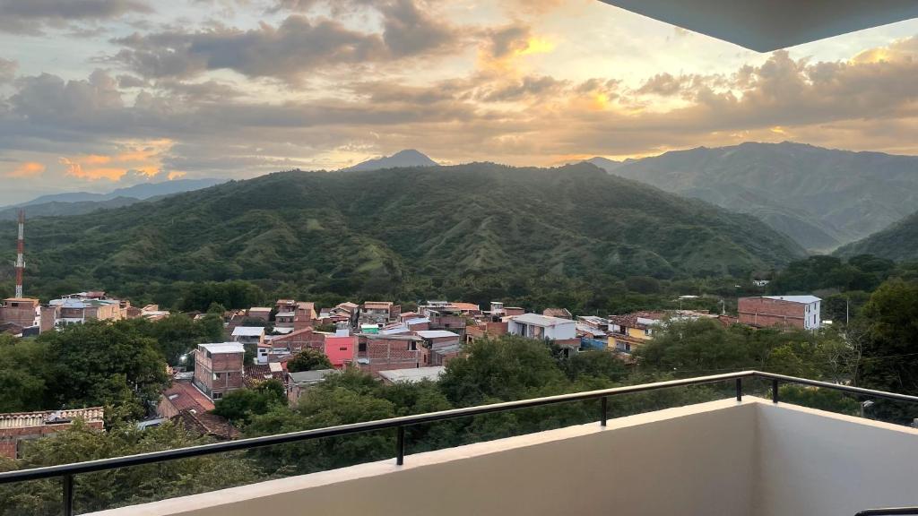 a view of a city from a balcony with mountains at ¡Vista Increíble Apartamento Tamarindo! in Santa Fe de Antioquia