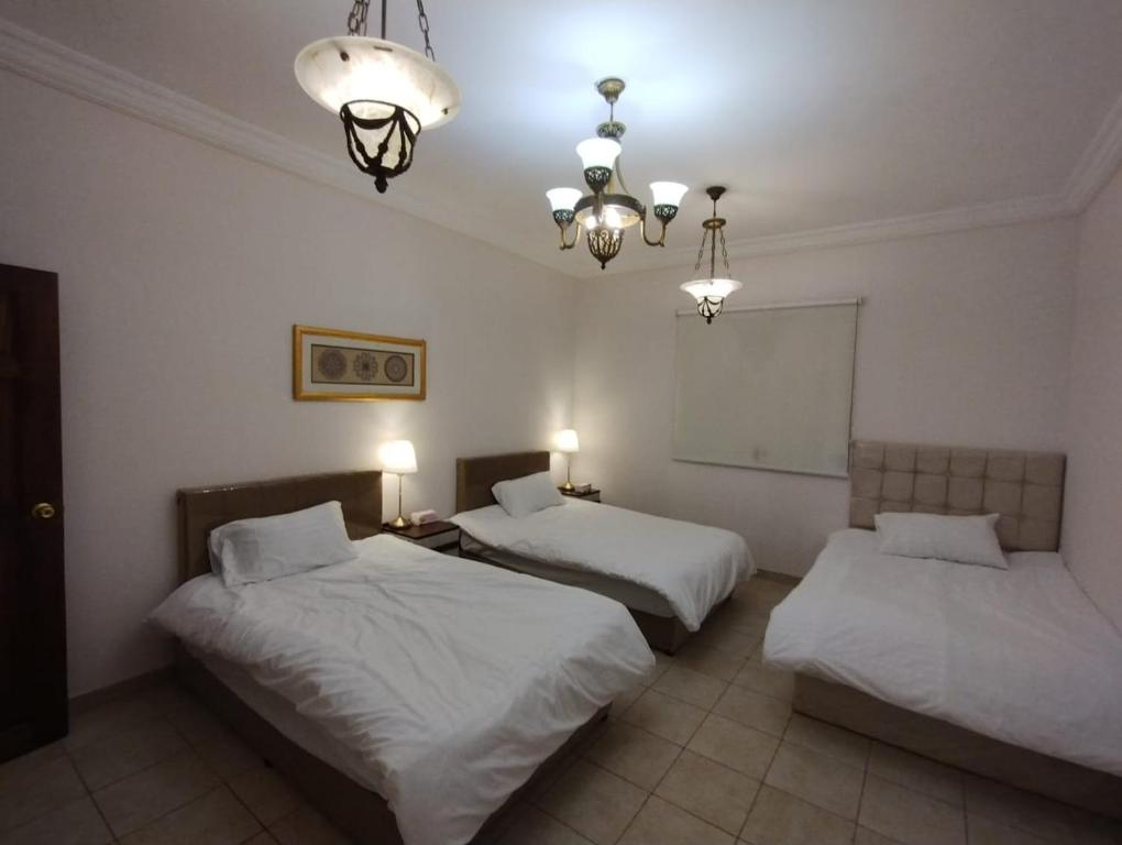 Кровать или кровати в номере Qurban Apartment
