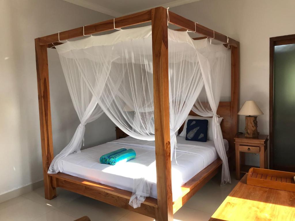 Letto o letti in una camera di GUS ARDITYA HOMESTAY
