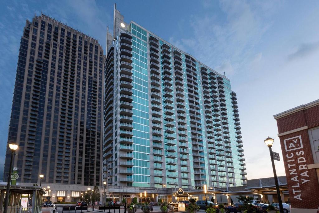 a tall building with a flag on top of it at Twelve Midtown, Marriott Autograph Collection in Atlanta