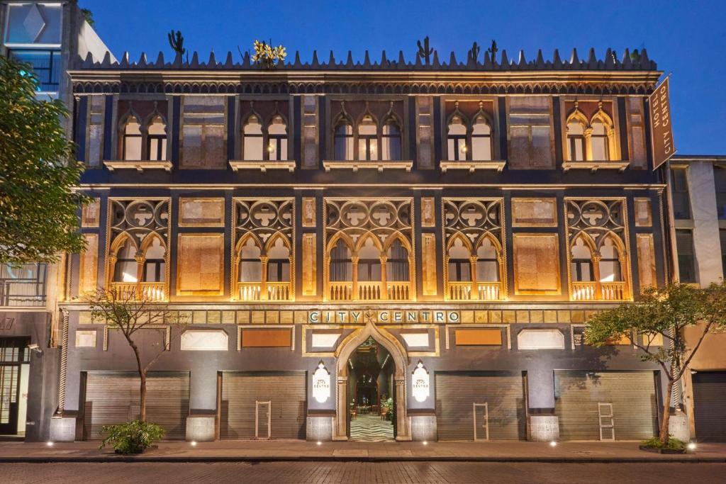 an old building with a sign on it at City Centro by Marriott Ciudad de Mexico in Mexico City