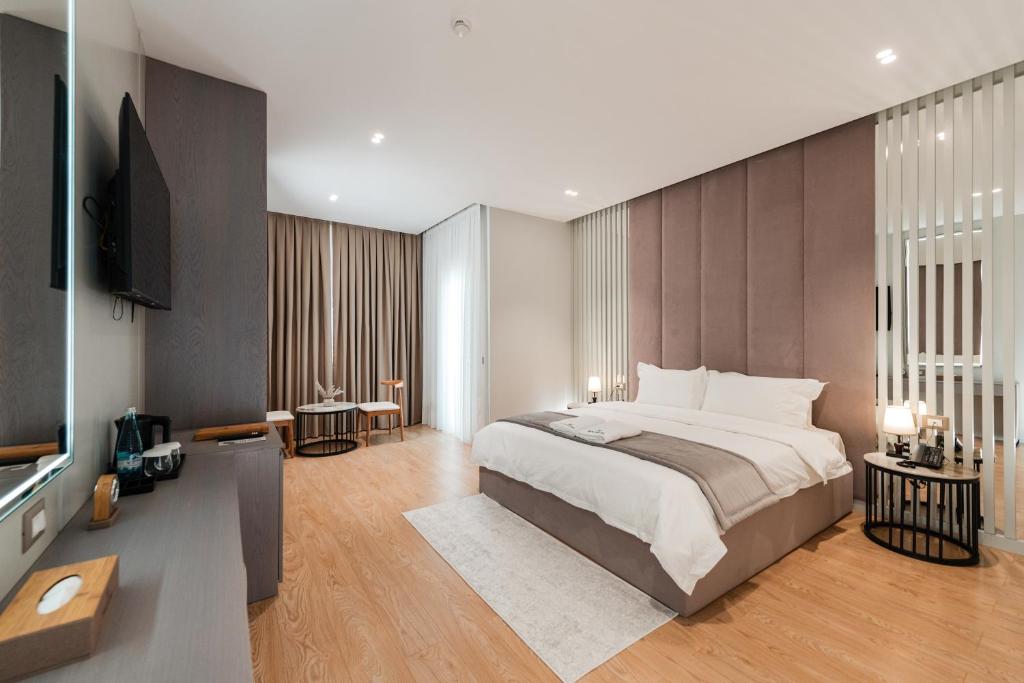 Cama o camas de una habitación en Troci Hotel