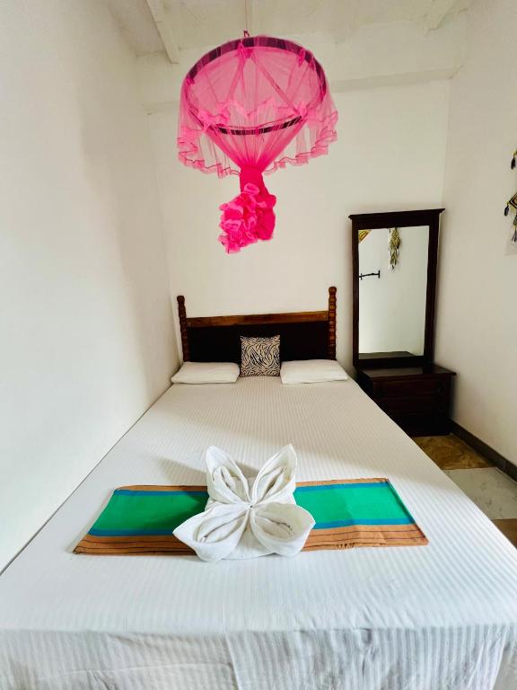 Postel nebo postele na pokoji v ubytování Dambulla Tourist Resort