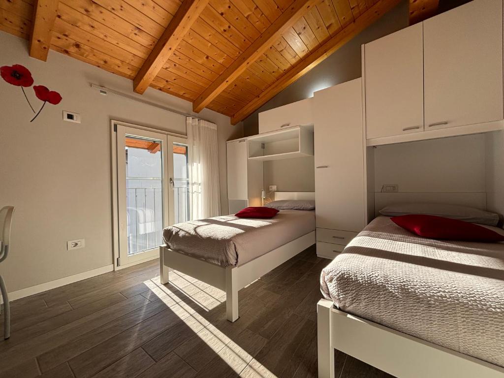 Postel nebo postele na pokoji v ubytování Ca' Ben Dongo - Larihome A53