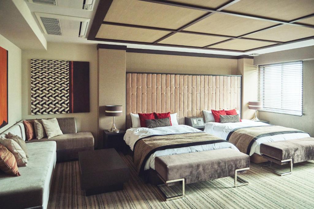 Postel nebo postele na pokoji v ubytování Hofu Grand Hotel