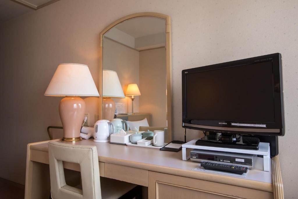 TV a/nebo společenská místnost v ubytování Hofu Grand Hotel
