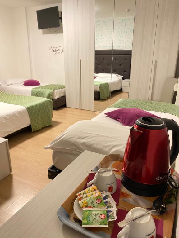 Postelja oz. postelje v sobi nastanitve Hotel B&B Lorenzini Ski