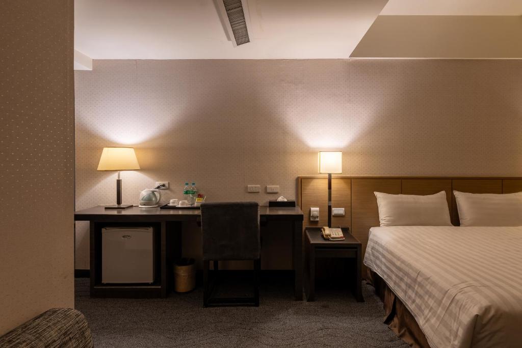 Postel nebo postele na pokoji v ubytování Guide Hotel Taipei Chongqing