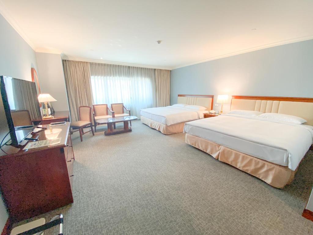 Voodi või voodid majutusasutuse Evergreen Laurel Hotel - Keelung toas