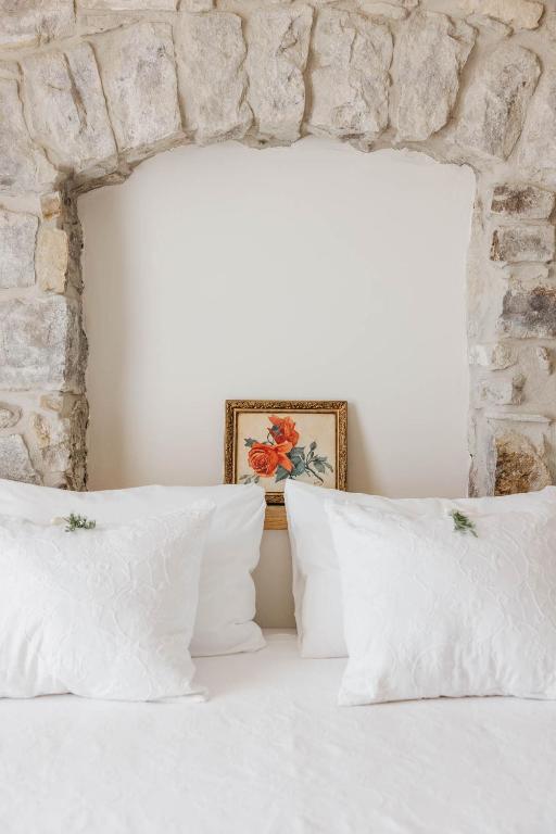 Postel nebo postele na pokoji v ubytování Apricus Locanda Boutique Hotel