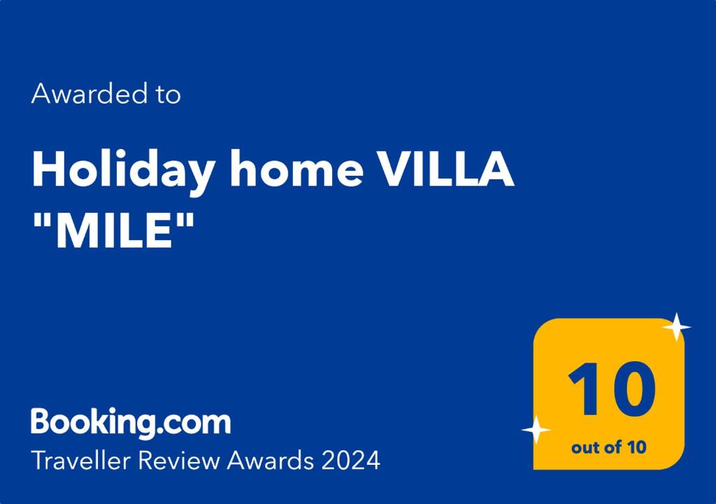 a sign that reads holiday home villa with a yellow rectangle at Villa &quot;Mile&quot; in Katuni