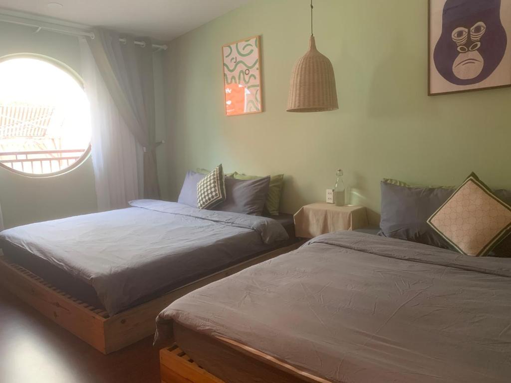 Postel nebo postele na pokoji v ubytování An Coffee House