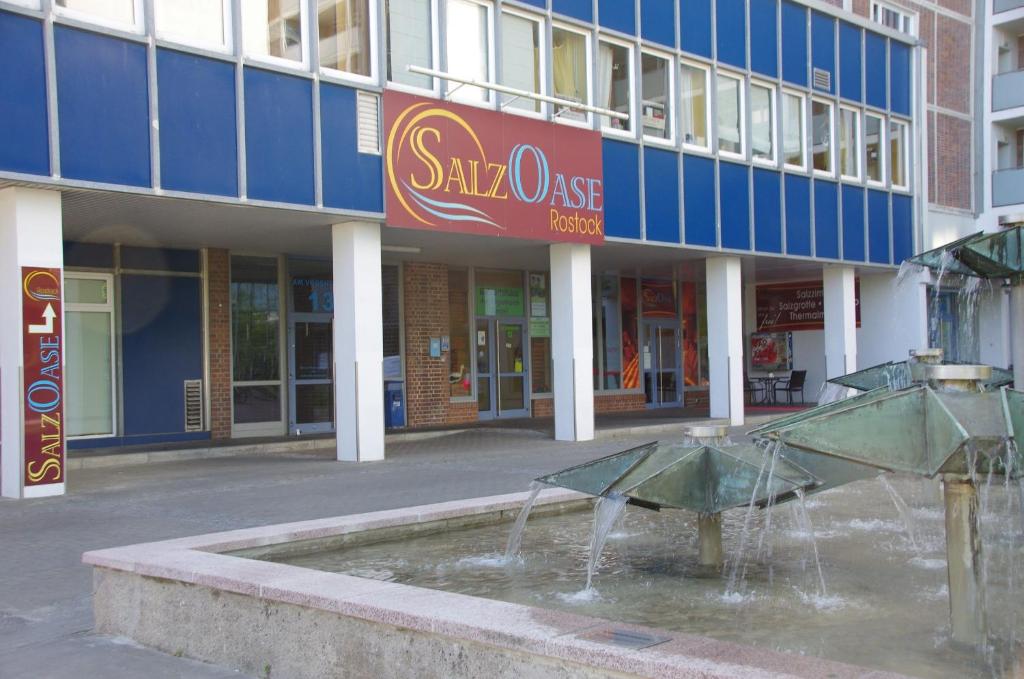 a water fountain in front of a shopping center at Ferienwohnung "Am Vögenteich" in Rostock