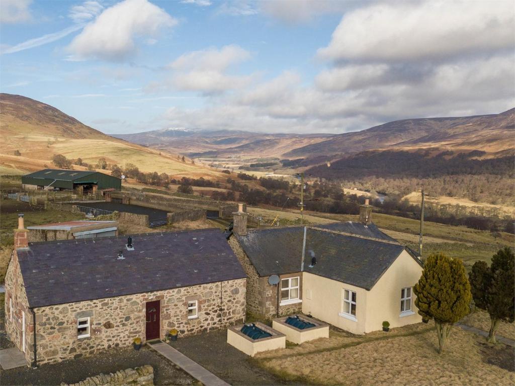 an aerial view of a stone house with mountains in the background at 1 Bed in Edzell CA335 in Edzell