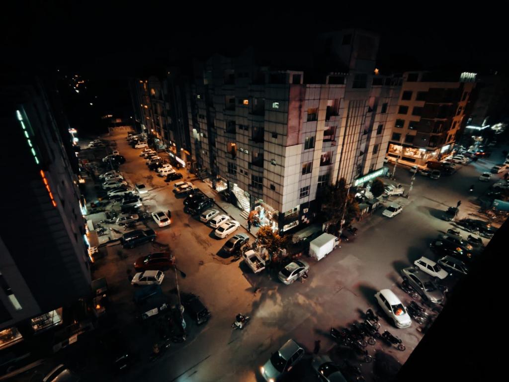 an aerial view of a parking lot at night at Stay in Comforts in Islamabad