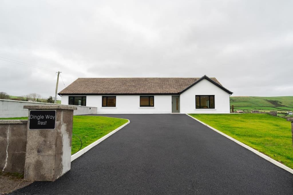 a white house with a driveway in front of it at Dingle Way Rest ,Luxury holiday home in Dingle