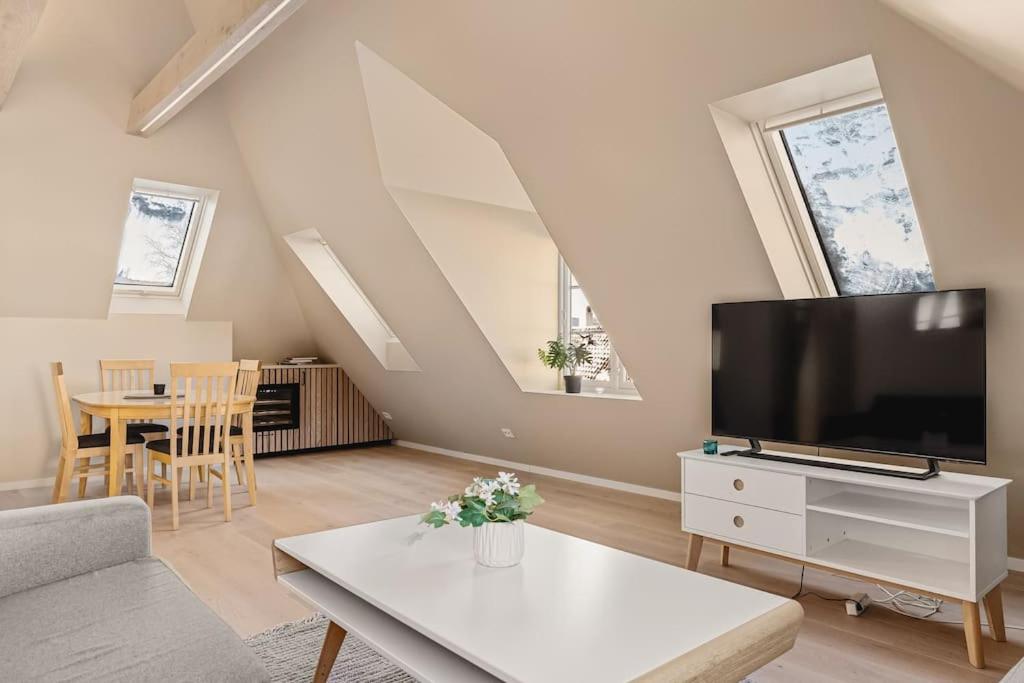 Image showcasing A Scandinavian Penthouse Apartment with Slanted Ceilings