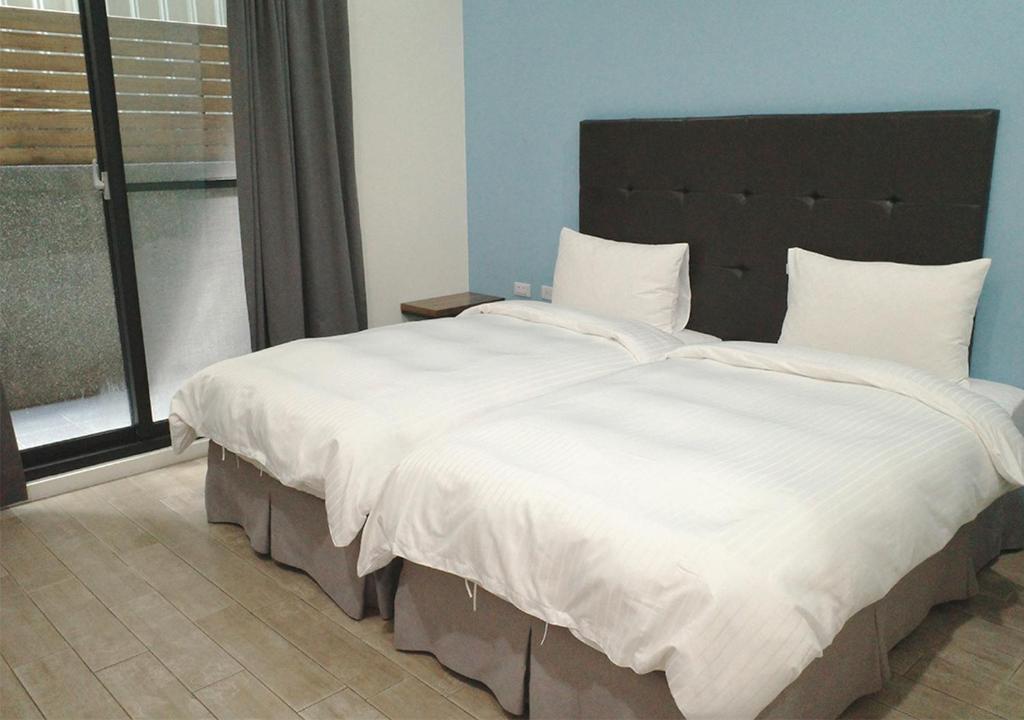 Postel nebo postele na pokoji v ubytování Happy Guesthouse