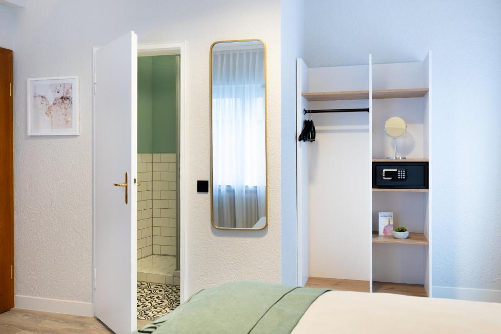 Postel nebo postele na pokoji v ubytování Garner Hotel Cologne - Engelbertz by IHG