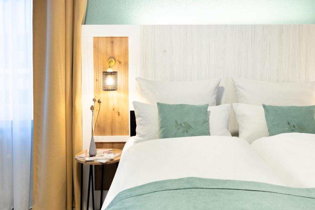 Postel nebo postele na pokoji v ubytování Garner Hotel Cologne - Engelbertz by IHG