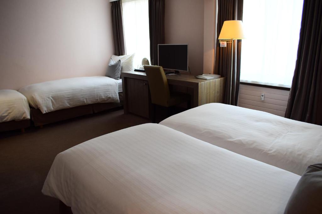 Postel nebo postele na pokoji v ubytování Hotel Central, SPA & LOUNGE BAR