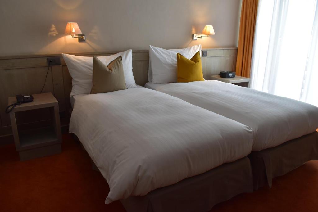 Postel nebo postele na pokoji v ubytování Hotel Central, SPA & LOUNGE BAR