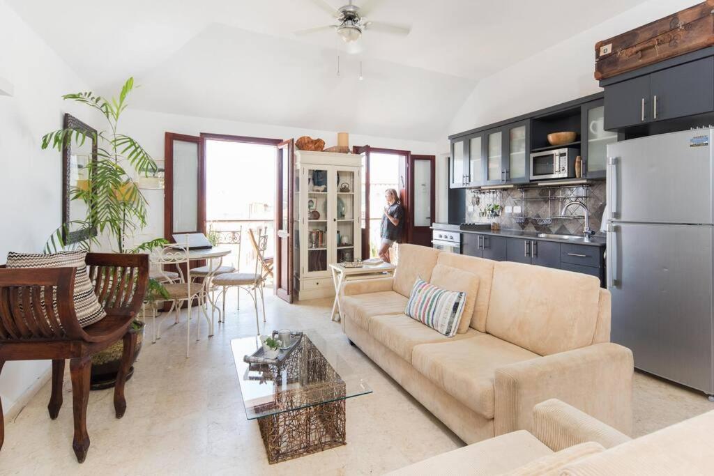 a living room with a couch and a table at Charming New Apt in Jaffa Near Sea in Tel Aviv