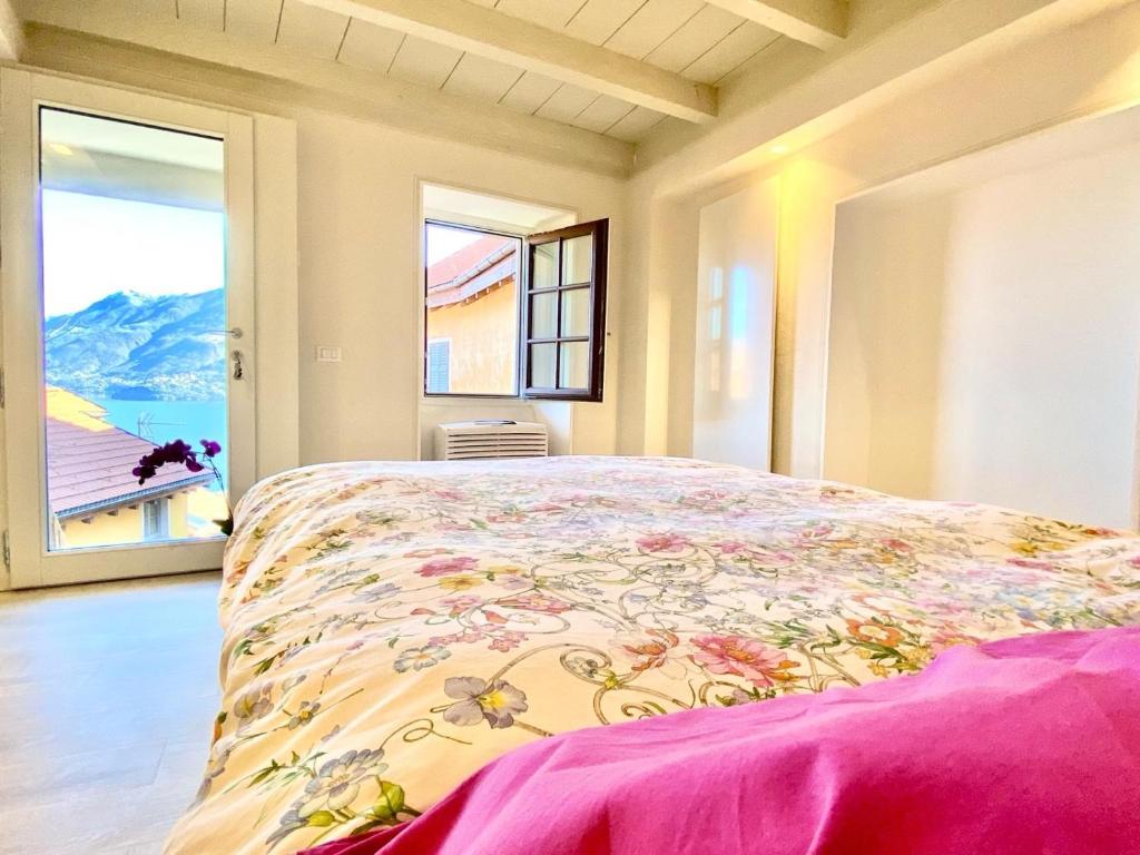 a bedroom with a large bed and a window at Casa Spasù in San Bartolomeo
