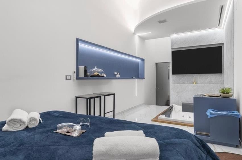 Postel nebo postele na pokoji v ubytování I Cappuccini Suite