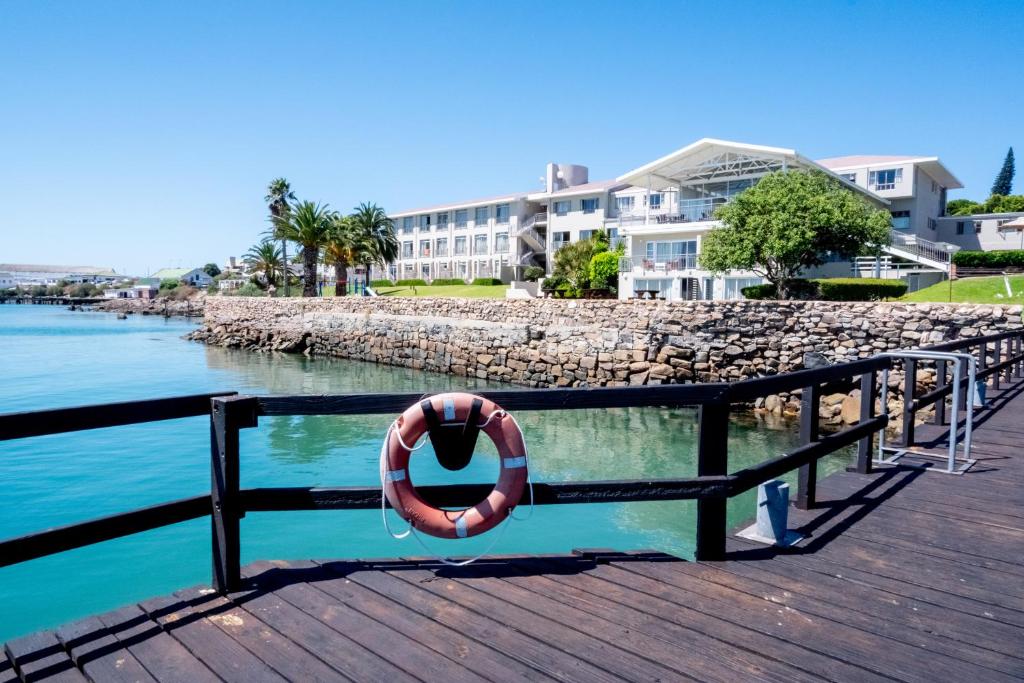 a life preserver on a dock next to the water at Saldanha Bay Hotel in Saldanha