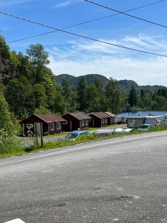 a row of houses on the side of a road at Svindland Camping in Kvinesdal