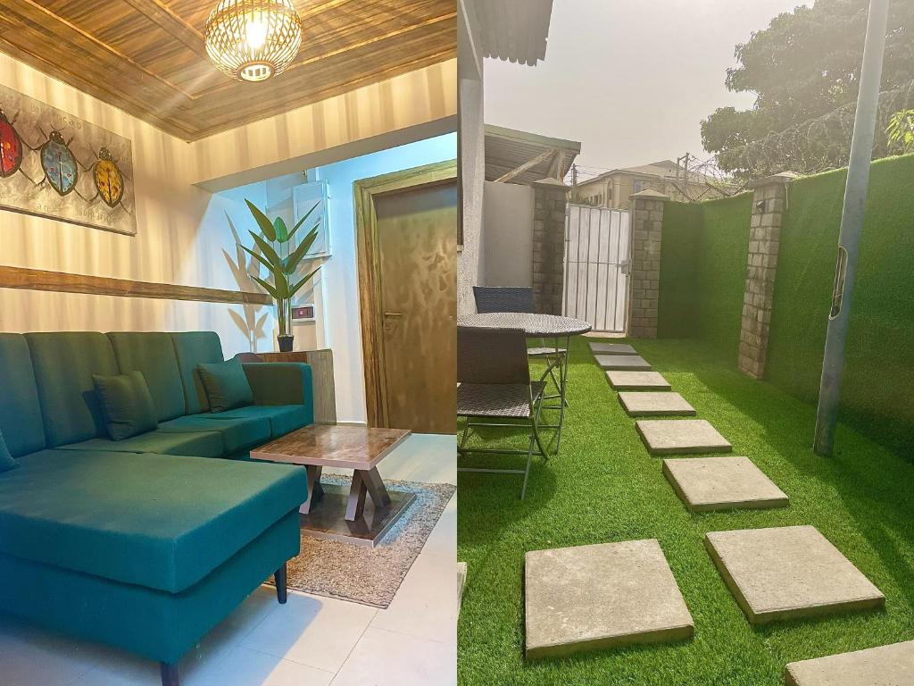 a living room with a couch and a table and grass at RUDISH COTTAGE (COZY & PRIVATE) in Abuja