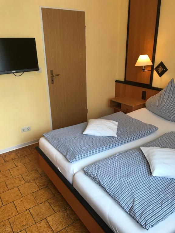 Postel nebo postele na pokoji v ubytování Zum Hanseaten