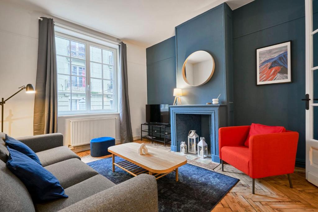 a living room with a couch and a fire place at 3 bedroom apartment, close to all amenities in Lille