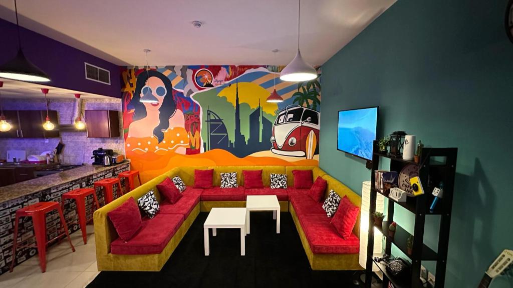 a living room with a couch and a table at Papaya backpacker's in Dubai