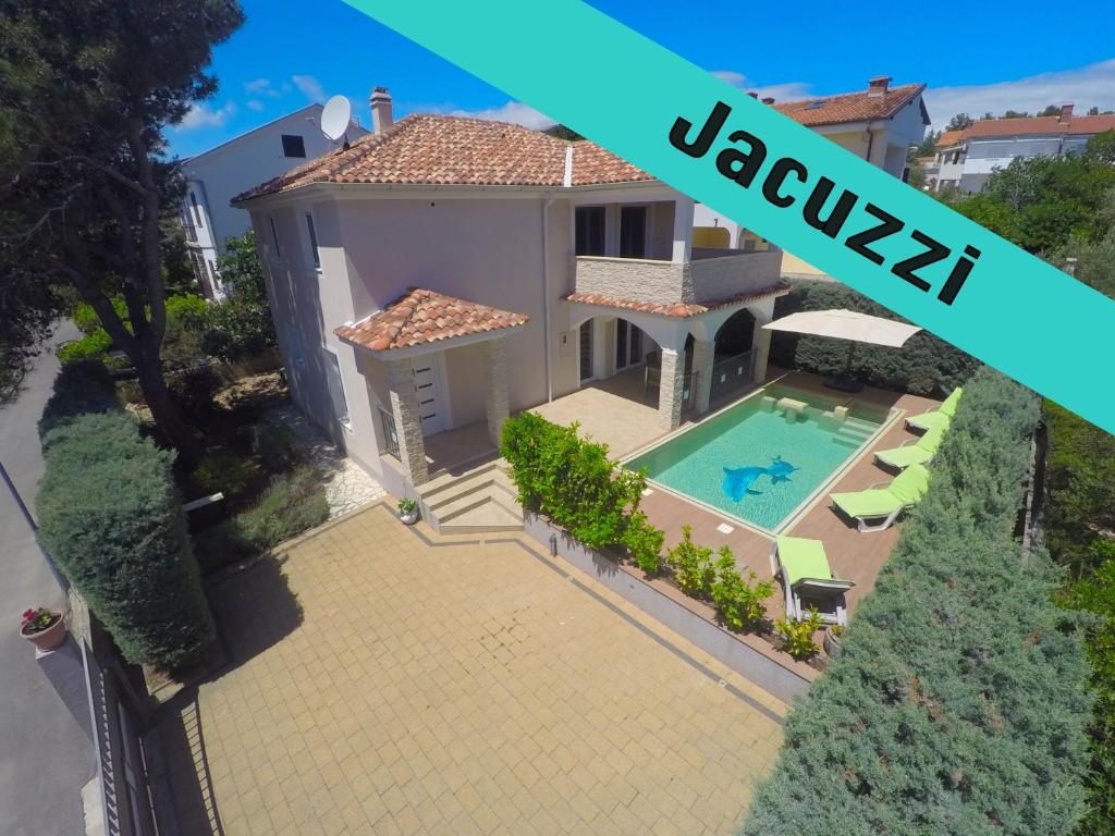 an aerial view of a house with a swimming pool at Villa KRK in Krk