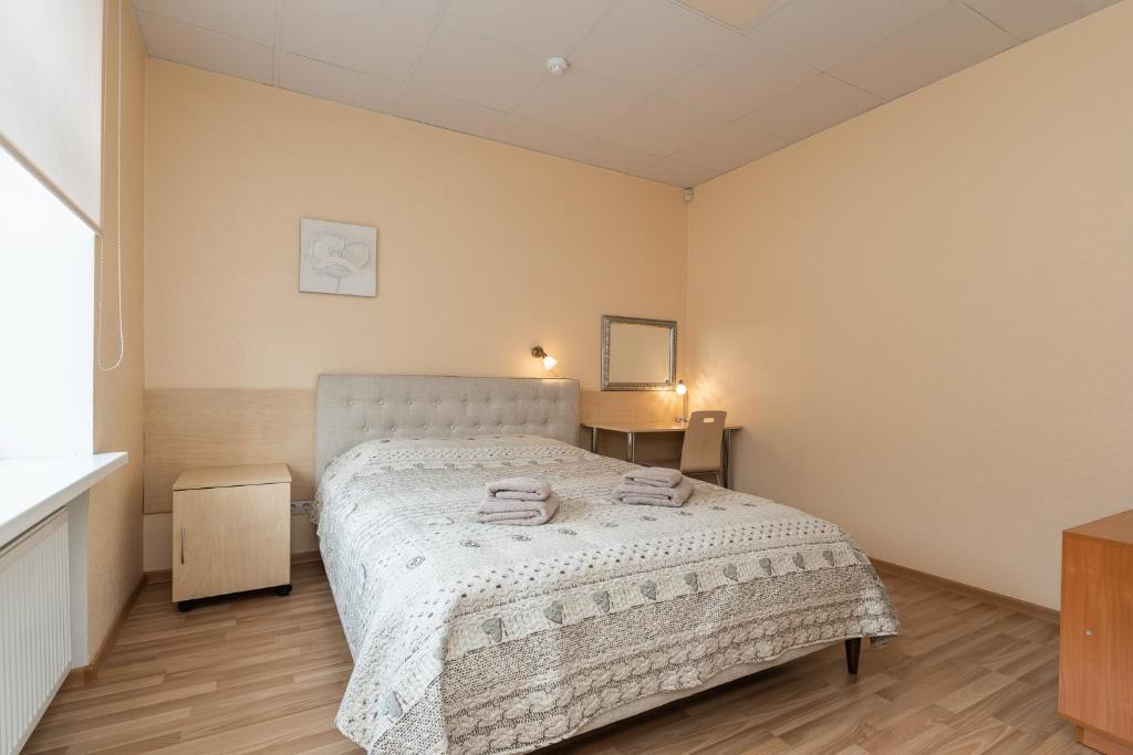 Postel nebo postele na pokoji v ubytování Virumaa Hostel